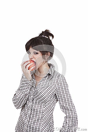 The girl biting a red apple Stock Photo