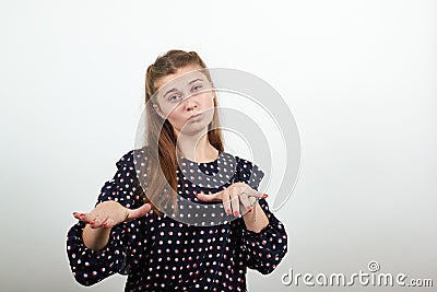 Girl in a black dress abruptly stretched out her arms and looks confident Stock Photo