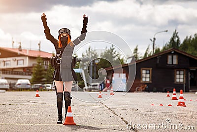 A girl in black military uniform of a special forces detachment. Without identification marks. Looks at the camera. A woman is Stock Photo