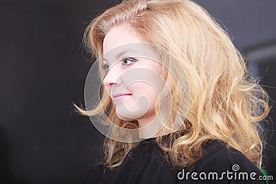 Girl with blond hair in hairdressing beauty salon Stock Photo