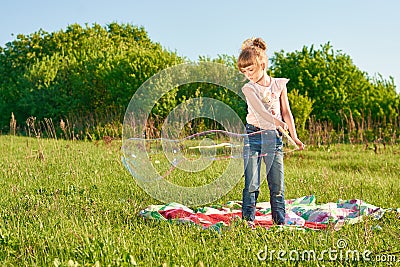 Girl blow bubbles Stock Photo