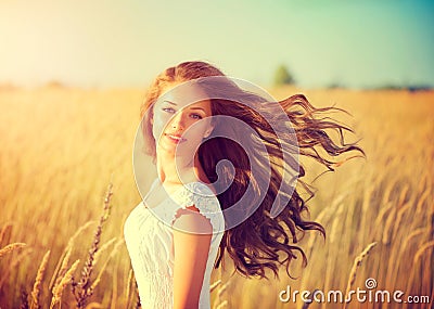 Girl with blowing hair enjoying nature Stock Photo