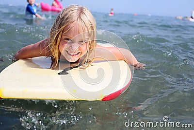 Girl bodyboarding Stock Photo