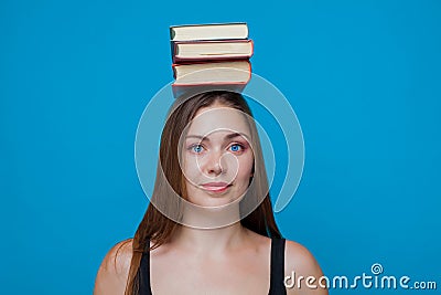 Girl with books on the head Stock Photo