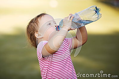 Girl with bottle of mineral water Stock Photo