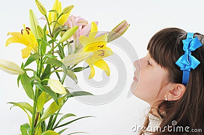 The girl and a bouquet of lilies. Stock Photo