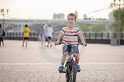 The girl or boy is engaged in rowing sitting in a boat rowing oars in rafting Stock Photo