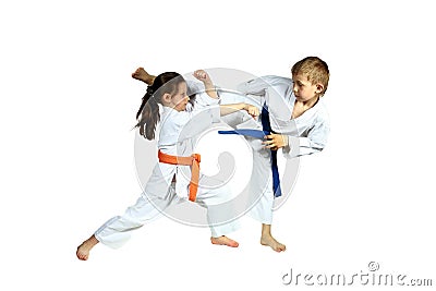 Girl and boy in karategi are training paired exercises karate Stock Photo