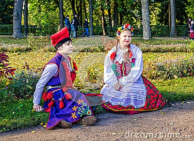 The girl and boy members of the Polish folk dance GAIK in traditional costumes. Editorial Stock Photo