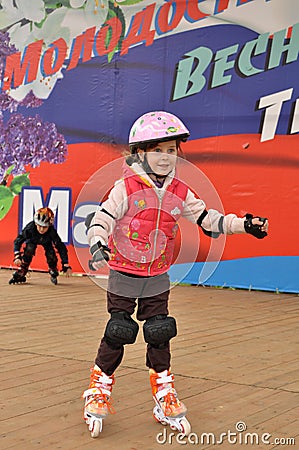 The girl and boy are rolled on rollers Stock Photo