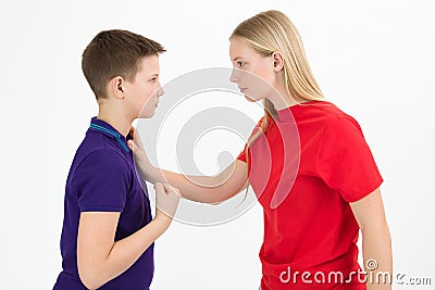 A girl and a boy sort out the relationship with a physical threat, close-up. Stock Photo