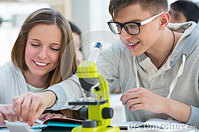 Girl and boy working together at biology Stock Photo