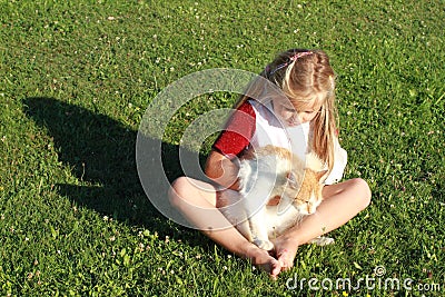 Girl with broken hand and cat Stock Photo