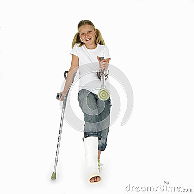 Girl with a broken leg walking on crutches Stock Photo