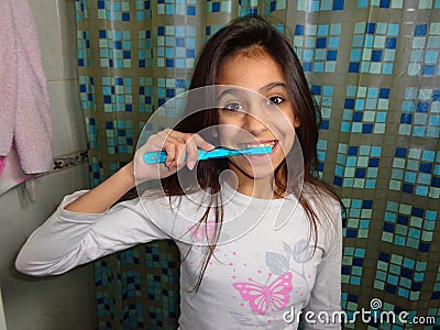 Girl brushing teeth Stock Photo