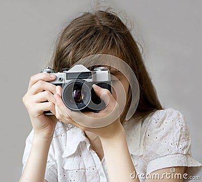 Girl with Camera Stock Photo