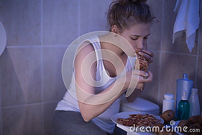 Girl can not control hunger Stock Photo