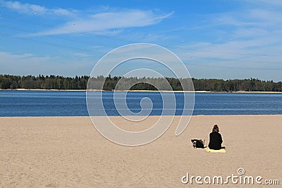 Girl alone on the beach in Helsinki Editorial Stock Photo