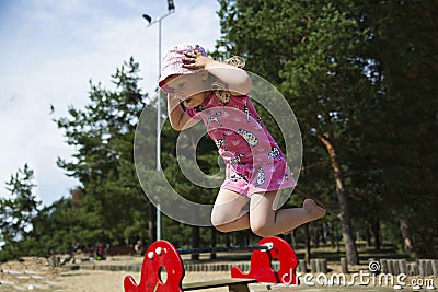 Girl captured on camera while jumping Stock Photo