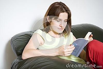 Girl captured by a novel Stock Photo