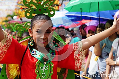 Girl carnival dancers in various costumes dance along the road Editorial Stock Photo