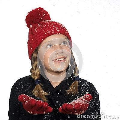 Girl catching snow flakes in her hand Stock Photo