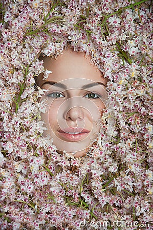 Girl among chestnut flowers Stock Photo