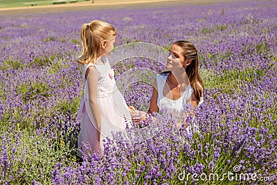 Girl with a child in a field of lavender Stock Photo