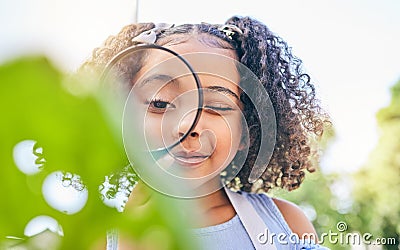 Girl child, magnifying glass and plants in garden, backyard or park in science, study or outdoor. Young female kid, lens Stock Photo