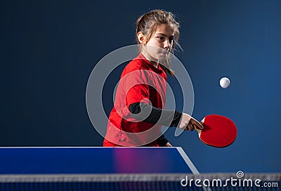 Girl child plays ping pong on indoor Stock Photo