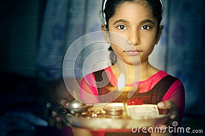 Girl child portrait holding prayer plate welcoming Stock Photo