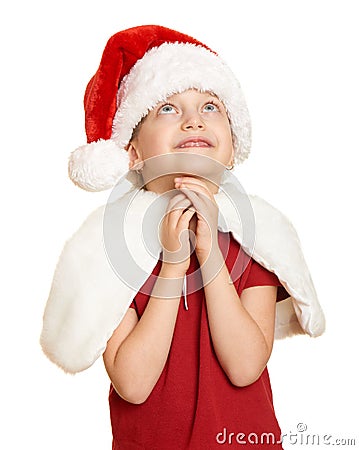 Girl child in santa hat pray, white isolated, christmas holiday concept Stock Photo