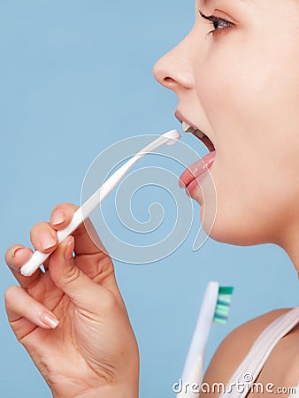Girl cleaning tongue. Dental care oral hygiene. Stock Photo