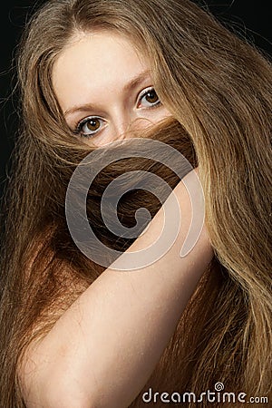The girl closes long hair the bottom part Stock Photo