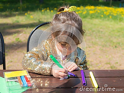 Girl with colored markers Stock Photo