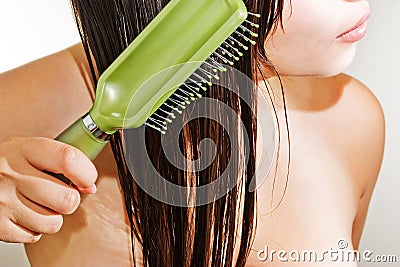 Girl Combing Hair Stock Photo