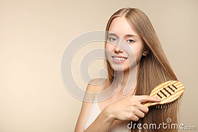 Girl combs long hair Stock Photo