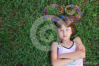 Girl with cornflowers in her hair and folded arms Stock Photo