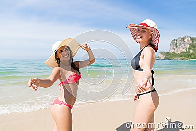 Girl Couple On Beach Summer Vacation, Young Woman Wear Hat Sea Ocean Stock Photo