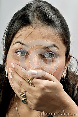 Girl with covered mouth Stock Photo