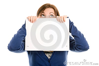 Girl covering face with blank note card Stock Photo