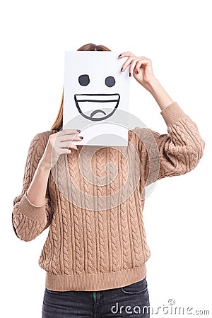 Girl covers the face with a white leaf with a cheerful smiley face on a white background Stock Photo