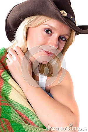 Girl in a cowboy hat with wrapped in a plaid Stock Photo