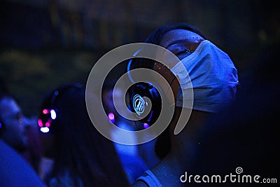 Girl in crowd enjoying silent disco stage Editorial Stock Photo