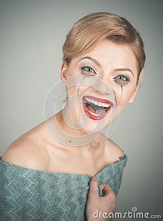 Girl cry with mascara streams on face. Lady with hair Stock Photo