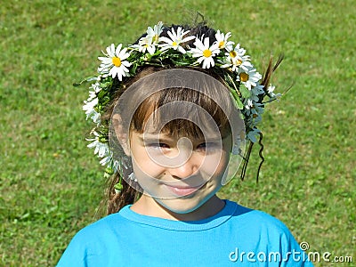 Girl with daisy chain on head Stock Photo