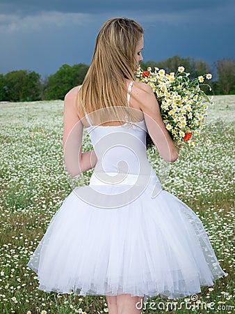 Girl in daisy field Stock Photo