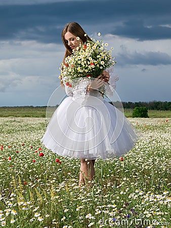 Girl in daisy field Stock Photo