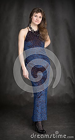 The girl in a dark blue evening dress Stock Photo