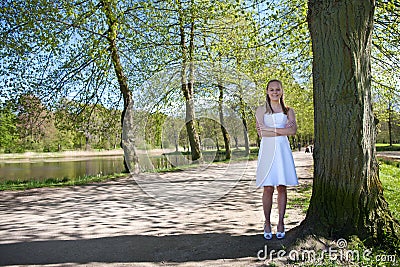 Girl the day of the confirmation standing Stock Photo